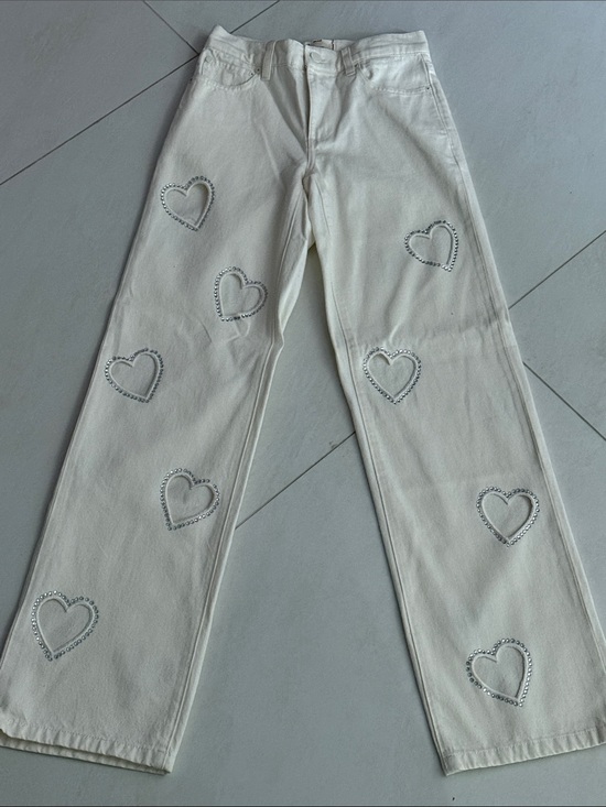 Alice + Olivia Denim - Alice + Olivia White Jeans with crystal heart cutouts. Never worn without tags.